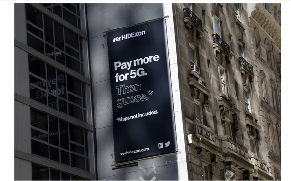 MediaPost's tweet photo. .@TMobile mocks @Verizon #5G rollout in #NYC, erects billboards calling it #VerHIDEzon https://t.co/yiEeXQQvOa @pjbtweet https://t.co/viIJOr62vh