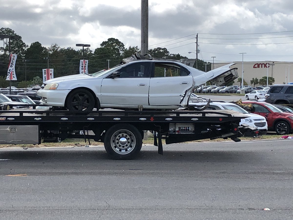 Hudson_Miller15's tweet photo. #BREAKING You can see this white car was basically cut in half during the collision at the intersection of Pensacola blvd and W street in #Pensacola after @FHPPanhandle was involved in a pursuit. More info as we get it. @weartv #C3N https://t.co/yWocRUKnt6