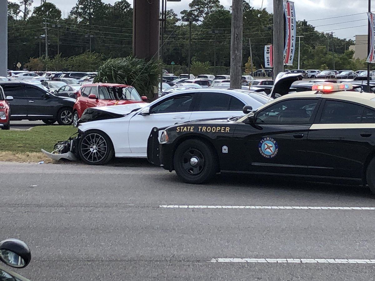 Hudson_Miller15's tweet photo. #BREAKING You can see this white car was basically cut in half during the collision at the intersection of Pensacola blvd and W street in #Pensacola after @FHPPanhandle was involved in a pursuit. More info as we get it. @weartv #C3N https://t.co/yWocRUKnt6