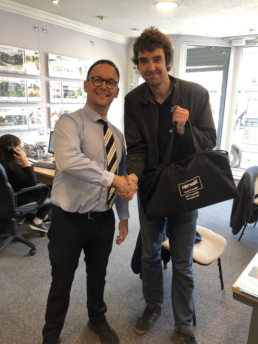 Another happy purchaser who has just picked up his keys and goody bag for his new home