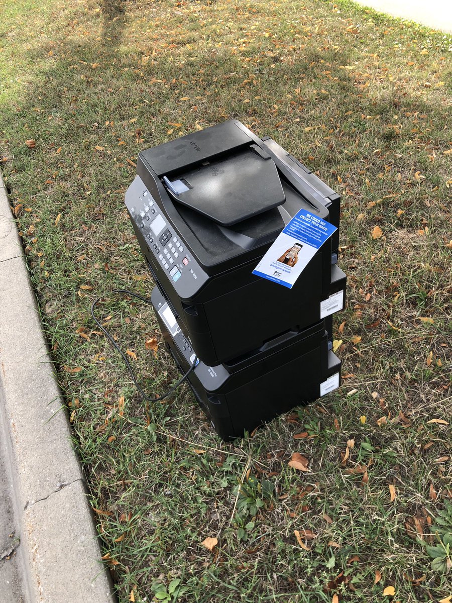 RobertBurns's tweet photo. Sigh, three failed Epson printers in three years. Top one was replaced under warranty only to fail months later. Perhaps 30 pages a month is more than a small office printer can handle. It seems even on unlimited trash day I still can’t wash this curse away. #epson #epsoncanada https://t.co/XlSU2zQnrK