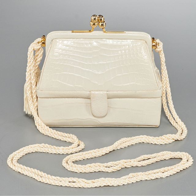 milleabros's tweet photo. Vintage Judith Leiber 007 crocodile evening bag. late 20th c., ivory with polished goldtone hardware, kiss lock closure, with removable woven shoulder strap with tassel detail, converts to clutch, hidden snap closure compartment, leather lined with Judit… https://t.co/eNJ2q6TA7e https://t.co/YCmNtfETRS