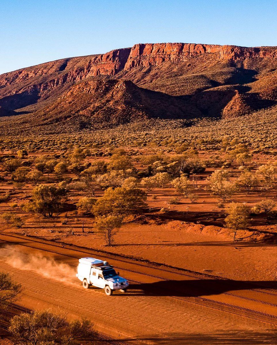 WestAustralia's tweet photo. Drive along the 45km loop around the biggest rock in the world, #MountAugustus and you'll make the most unforgettable travel moments! 🚗 The @Golden_Outback is just so picturesque you can't resist snapping up a storm 📸. (via IG/seanscottphotography) #thisisWA https://t.co/g4lBwZk7dy