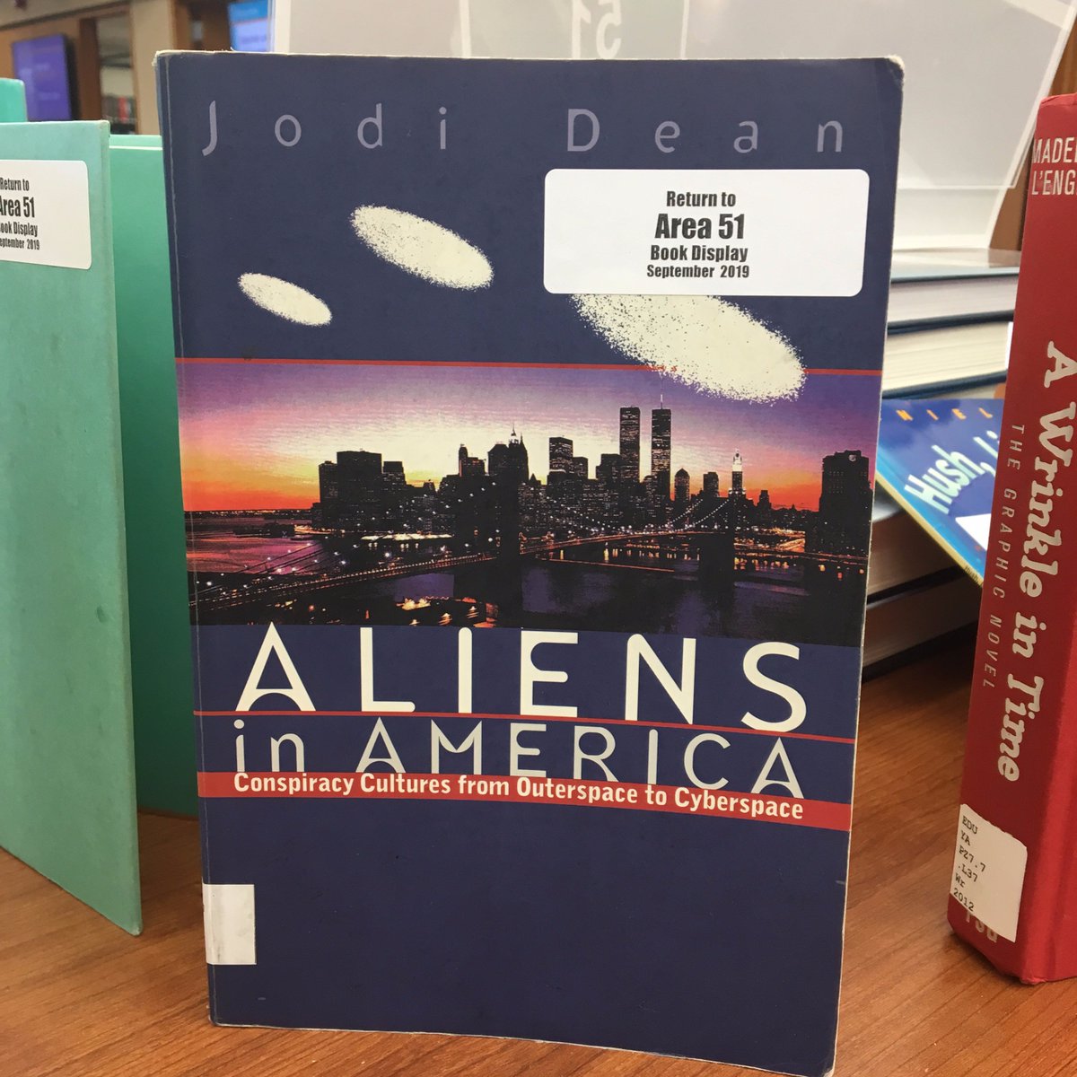 clemsonlibrary's tweet photo. Welp, the Area 51 raid was scheduled for today. Looks like it didn't go too well, but check out the book display next to Cooper's circulation desk! #LibraryShenanigans https://t.co/mHXBM6CPzj