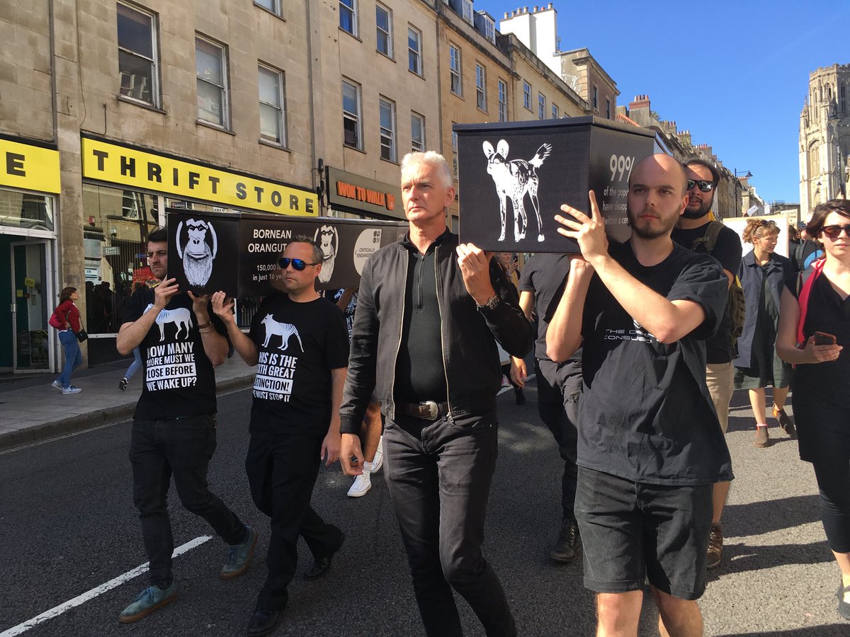 sajlanfear's tweet photo. Wildlife film making community strike in #Bristol for #GlobalClimateStrike #ExtinctionRebellion #coffins donated by ⁦@ecocoffin⁩ #biodegrable https://t.co/N6cq5Eyaan