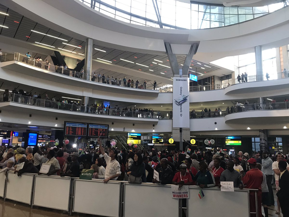 cnandco's tweet photo. Ready and waiting to welcome the Ndlovu Youth Choir home! A phenomenal atmosphere at the airport, an energy and unity that is hard to put words to. @SArising #Proud @ChoirAfrica https://t.co/g0dAJuTns5