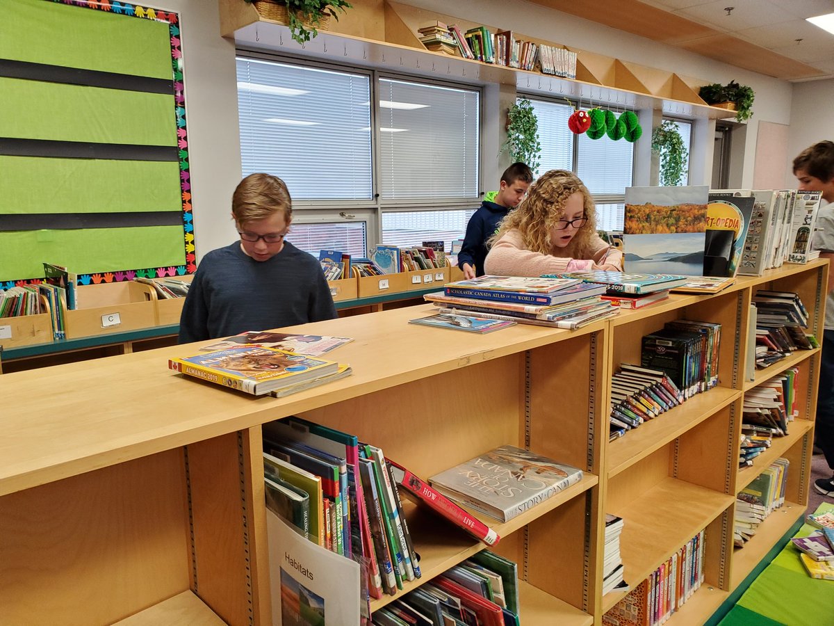 LearningwithMsG's tweet photo. Grade 6 and 7s are testing their knowledge of book genres by exploring the library and finding books in each genre. We learned about genres AND got to know our library layout better! https://t.co/f6Fe2DUKqb