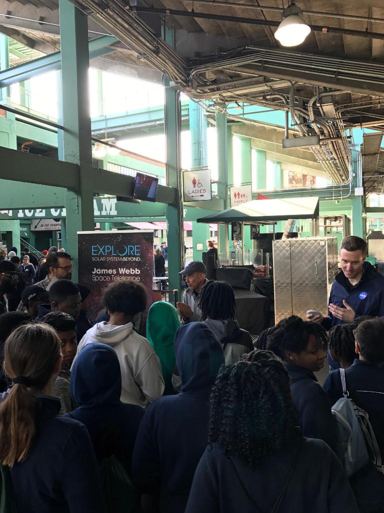 Webb staffers talk to students at the Webb Telescope booth. 