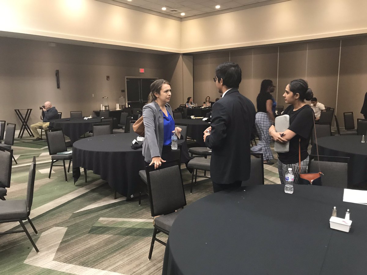 AnberithaT's tweet photo. Speaker being congratulated on a presentation well done by listeners @UABCardiology #CCVC19 https://t.co/F60TUzZIss