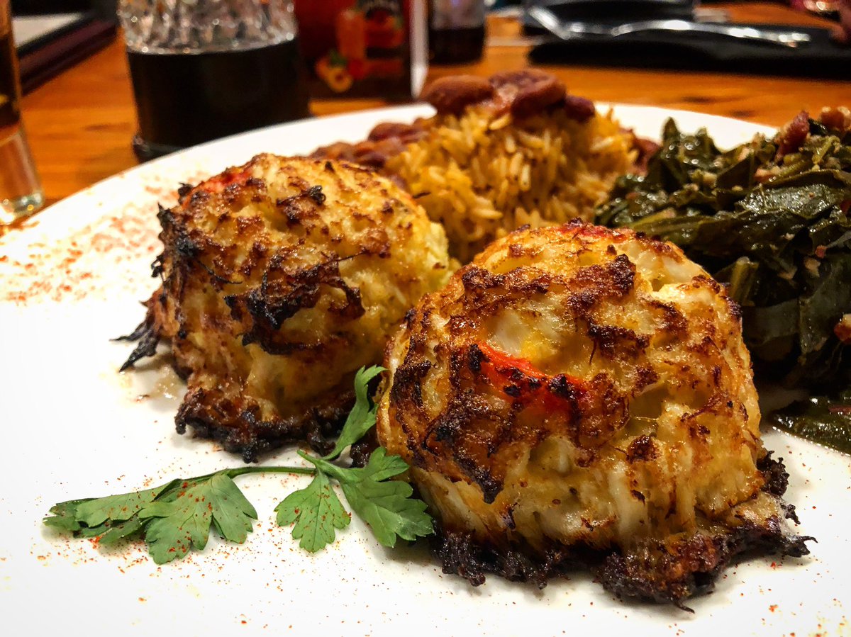 Delicious Crab Cakes with collard greens and red beans and rice. Heaven. #ruizing