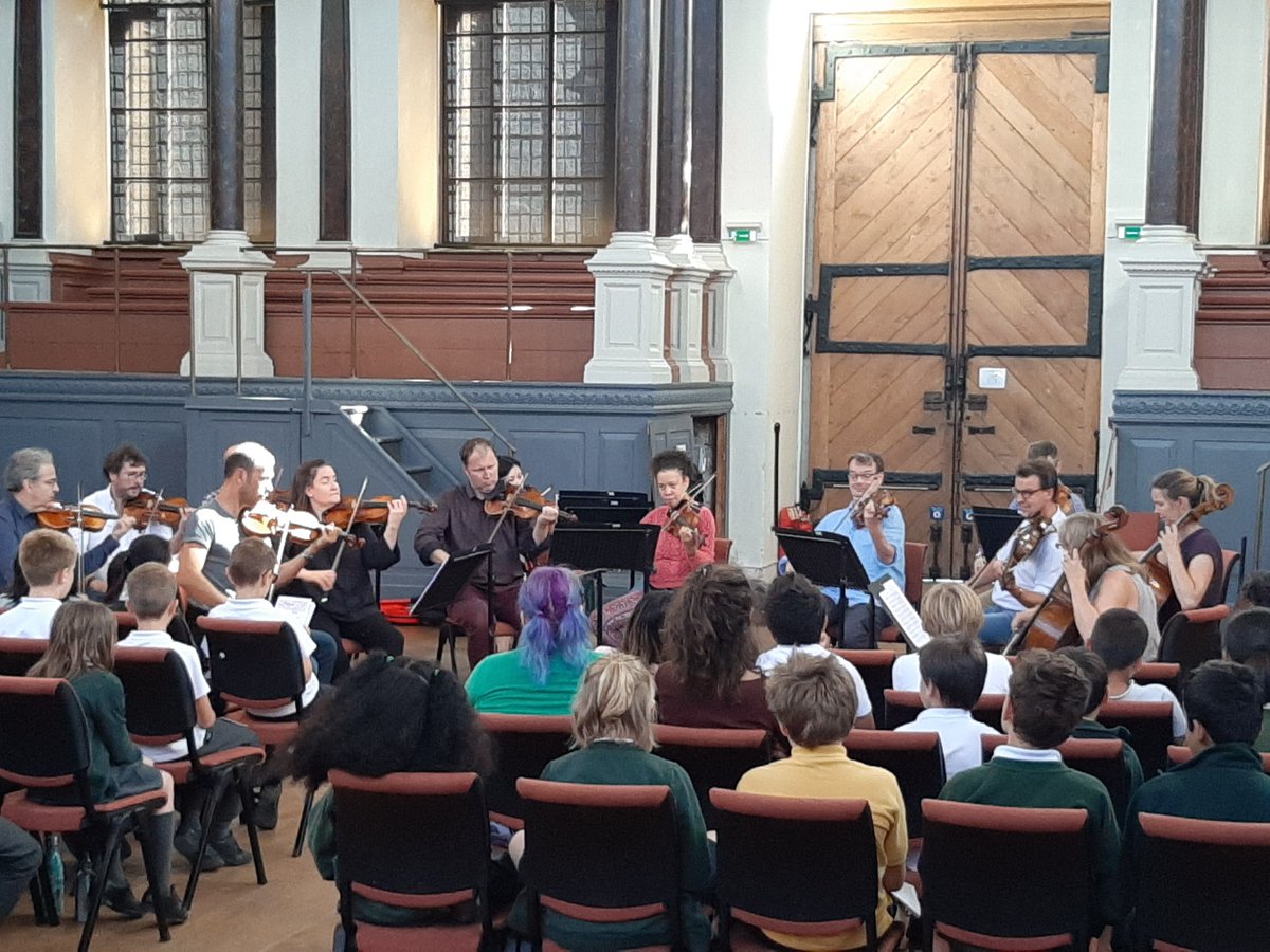 OxConcert4Peace's tweet photo. Lovely afternoon of rehearsal with @worldorch_peace and local primary schools before the concert tomorrow in the #Sheldonian. There's still time to get your tickets! # rotary #peaceoneday #peaceawareness #music4peace https://t.co/R0wKIXeodP
