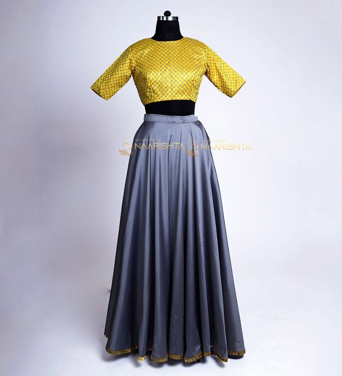 naarishta's tweet photo. Raise your desirability quotient and exude a look cut above the rest by gracing this grey flared #lehenga with #embroidered crop top designed exclusively at #Naarishta.

For more:https://t.co/lOdG2HQQiw

#silklehenga #blousetop #yellowblouse #croptop https://t.co/M5rsqHHqYS