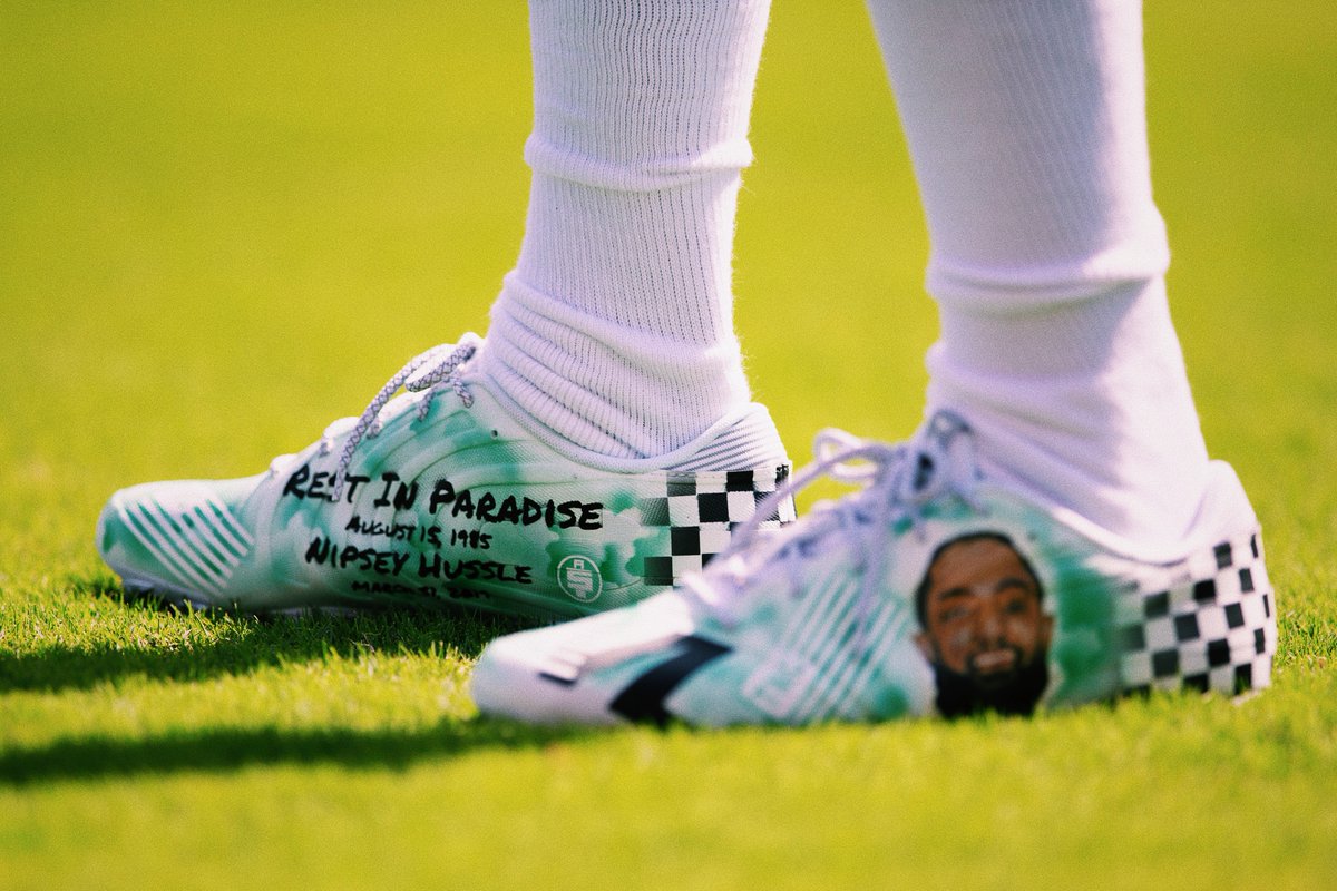 BleacherReport's tweet photo. D-Jax says he will warm up in cleats honoring Nipsey Hussle every game and auction them off. Proceeds will go to Nipsey’s family.

That’s real 🙏 @brkicks https://t.co/f8Lze4v3i2
