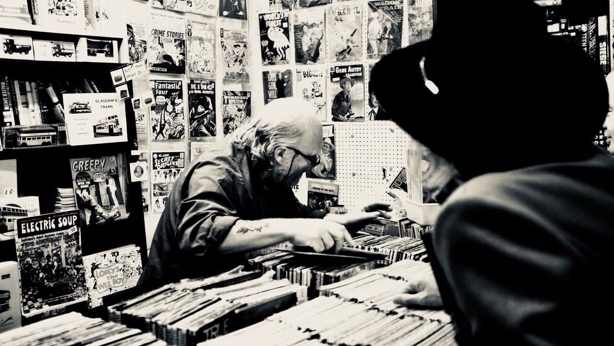 Buying vintage comix at Barras Market yesterday, Glasgow. Photographed by Steve Wickham. #thebarras #glasgow #thewaterboys