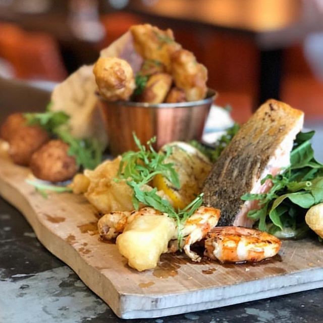 The Wine Kitchen now serves HOT food all day. So if it’s a sharing fish board or a hot lasagne you’d like for your lunch, come on in. We’ve warm sandwiches, SPECIAL of the day, flat breads, croquettes, triple cooked chips. All the foods you know you shouldn’t have but you wa…