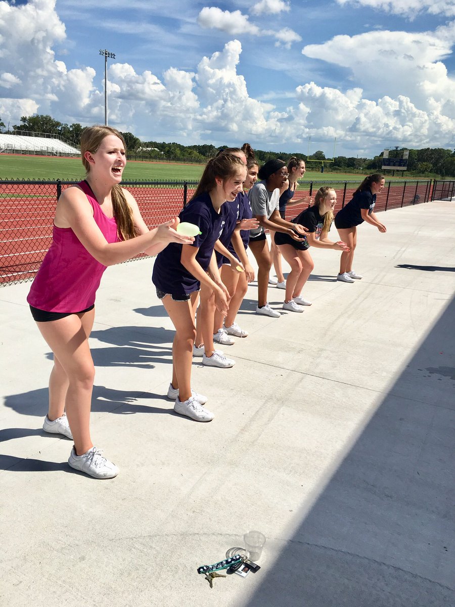 PCHSBullsCheer's tweet photo. We took it to the field today to run through our game day routines. If you haven’t heard, our first PCHS football game is this Thursday! These girls have been working hard and it was HOT 🥵 out there so they deserved a team bonding break! #cheerleaderchallenge #captainvscaptain https://t.co/8o1dpH4ff7