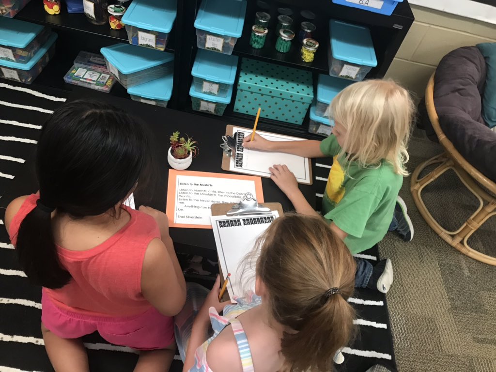 Miss_Wiberg's tweet photo. We started our poetry unit today with an around-the-room exploration of poems. They were completely silent and engaged without any prompting. I think I have a group of little poets on my hands! 🥰 https://t.co/ruO8Gse8mW