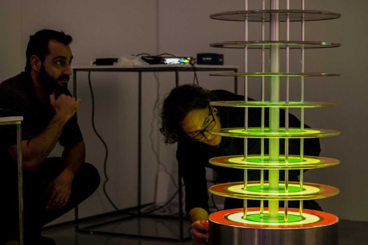 UCA_Technicians's tweet photo. This is @uca_mct technician Vangelis and local artist Jamie Barrett  putting together their sound and light installation for #UCATechX. Come and see it from September 11th at @UniCreativeArts in Farnham #Futuretro #TechX #TechniciansMakeitHappen #TechsCommit #Technicians https://t.co/JOxkLdBESz