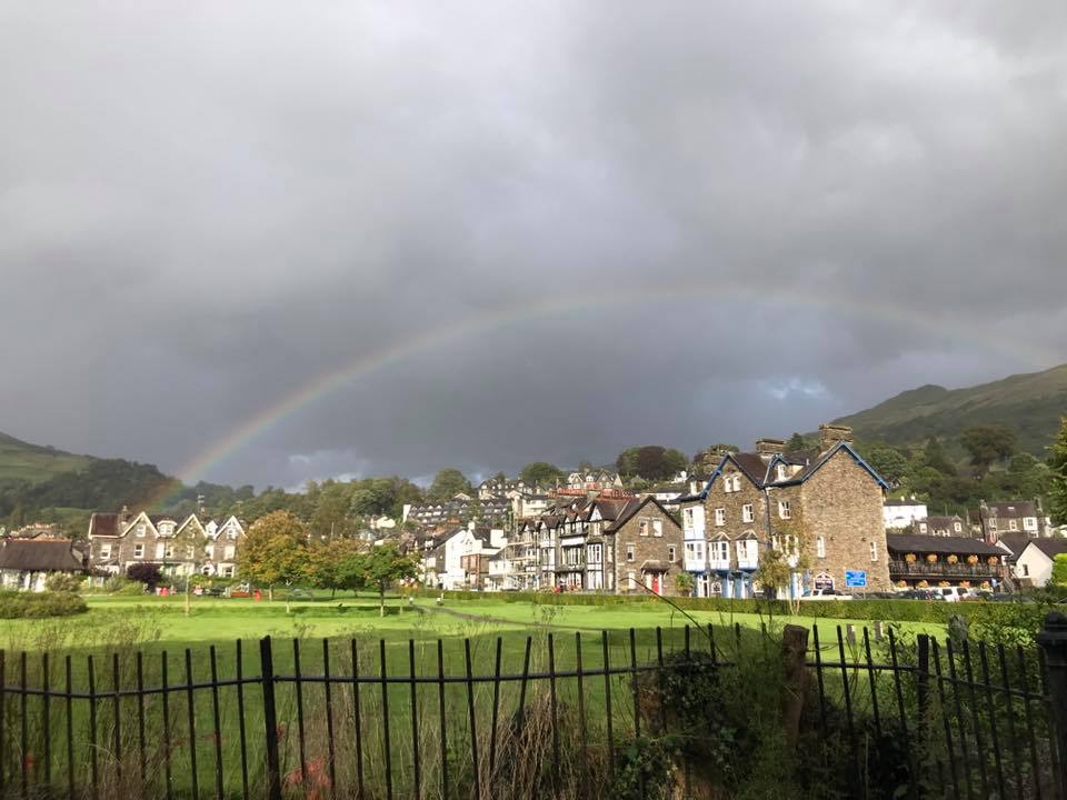 GablesGH's tweet photo. It's worth putting up with a spot a rain to see a lovely rainbow like this framing our lovely village! #Ambleside https://t.co/jNIrXl4hId