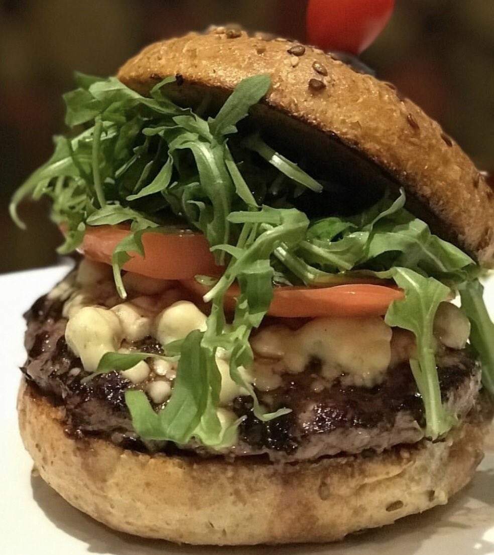 Our Bison Burger. Truffled blue cheese, arugula, tomato an a multigrain bun.  
#burgers #westchester #westchestereats #whiteplains #mountkisco #ryebrook #stamford #happyhour #desserts #foodtruck #catering #privatedining #eventplanning #weddings