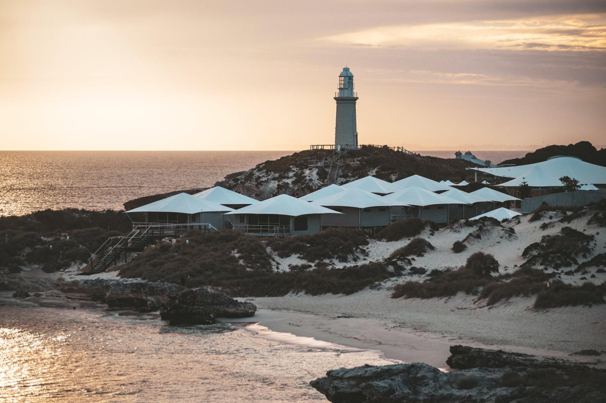 WestAustralia's tweet photo. Any guesses as to why @RottnestIsland is considered @DestPERTH's very own holiday adventure getaway 💙😍? We're sure you can see why with this gorgeous sunset on #BathurstLighthouse, which was built back in 1900. Find out more here: https://t.co/9B7JnXjSks https://t.co/WeYQXmyAju