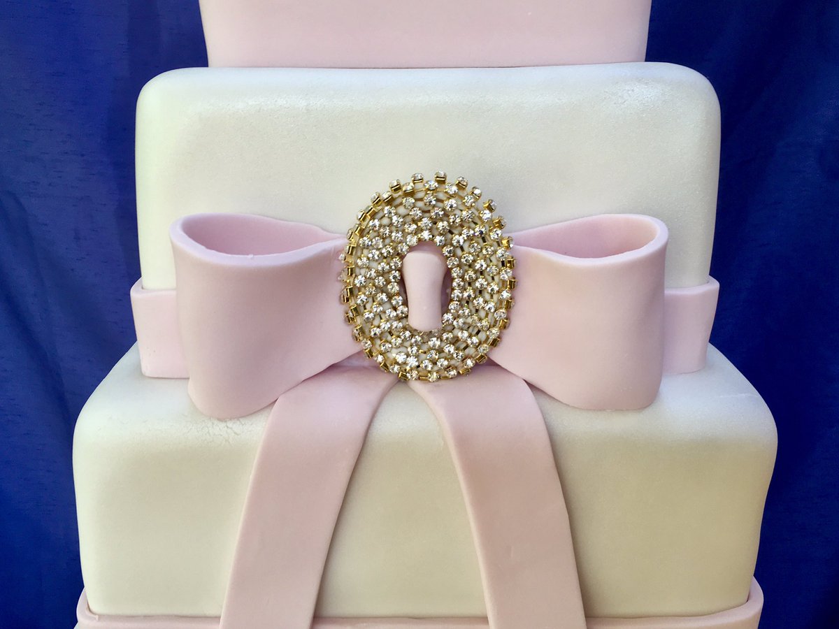 Stylish five tier cake decorated with edible bow and sparking diamantés.  #ScottishRomance #peebles #weddingcakes #scottishweddings #dundas #borderweddings #marriedinscotland #rainbowsugarcraft #cake #weddingcake #weddings