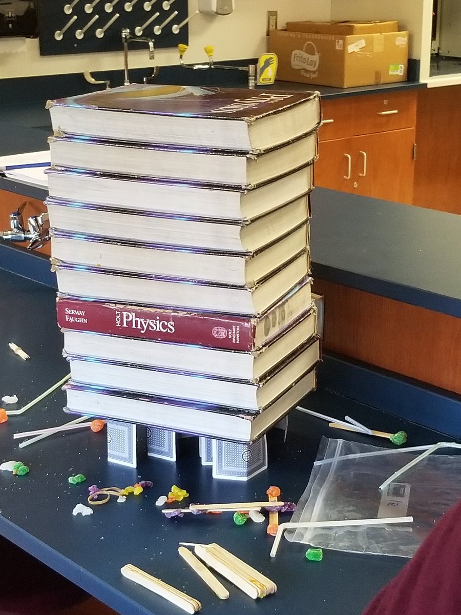 GKovscek's tweet photo. Students built a book support  for honors physics. One team had a good idea, another team pilfered the idea and added to it and stacked 12 books before it collapsed with 13 #uppingOurGame #ThisIsBASD #BHSPHYSICS https://t.co/chGkJdTHDD