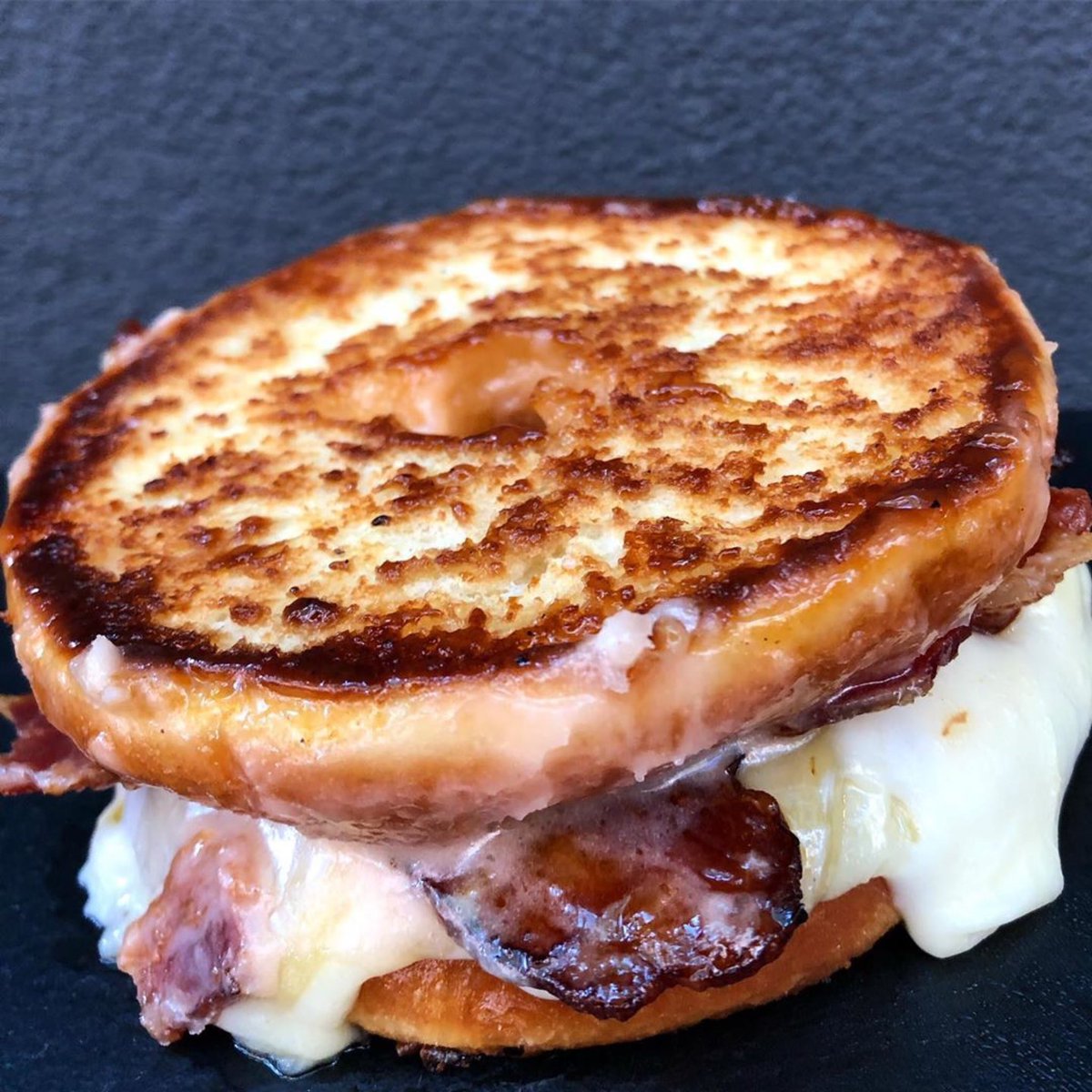 MurraysCheese's tweet photo. This weekend only at Murray’s Melts: DOUGHNUT GRILLED CHEESE. @TDP_NYC habanero glazed bacon doughnuts, @considercheese Pawlet and Italian Fontina Fontal, all Grilled together. Only at our Melts on Bleecker St. Only this Saturday and Sunday. Only 12 made. Don’t miss it! https://t.co/pLy5re6jmO