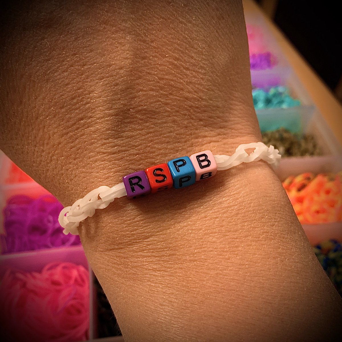 elliott_bunker's tweet photo. Just got presented with a #LimitedEdition #RSPB #LoomBand by my eldest son. I love it, but tried to explain that purple, red and pink were not in our brand book, he didn’t quite get it! 😂🐦 https://t.co/ynRyyfei04