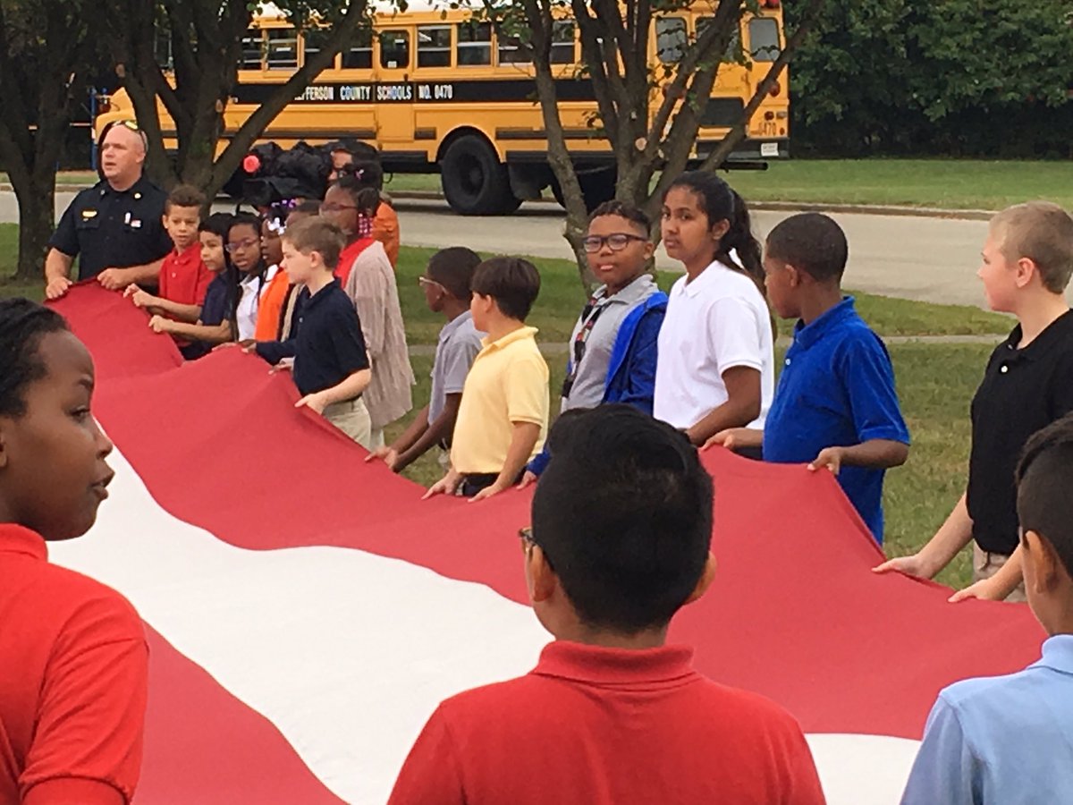 JCPSKY's tweet photo. .@LuhrLions students are assisting @JeffCoFire with #Sept11 ceremony this morning. At 8:46am, they unfolded a 20' X 40' United States Garrison Flag, displayed it for a moment of silence and folded it back up. They will do it again at 9:03am. #WeAreJCPS https://t.co/KsqlRO52G4