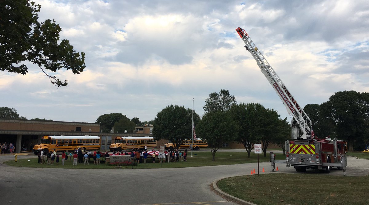 JCPSKY's tweet photo. .@LuhrLions students are assisting @JeffCoFire with #Sept11 ceremony this morning. At 8:46am, they unfolded a 20' X 40' United States Garrison Flag, displayed it for a moment of silence and folded it back up. They will do it again at 9:03am. #WeAreJCPS https://t.co/KsqlRO52G4