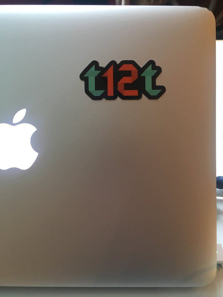 Laptop sticker saying “t12t” which is the swedish equivalent of a11y