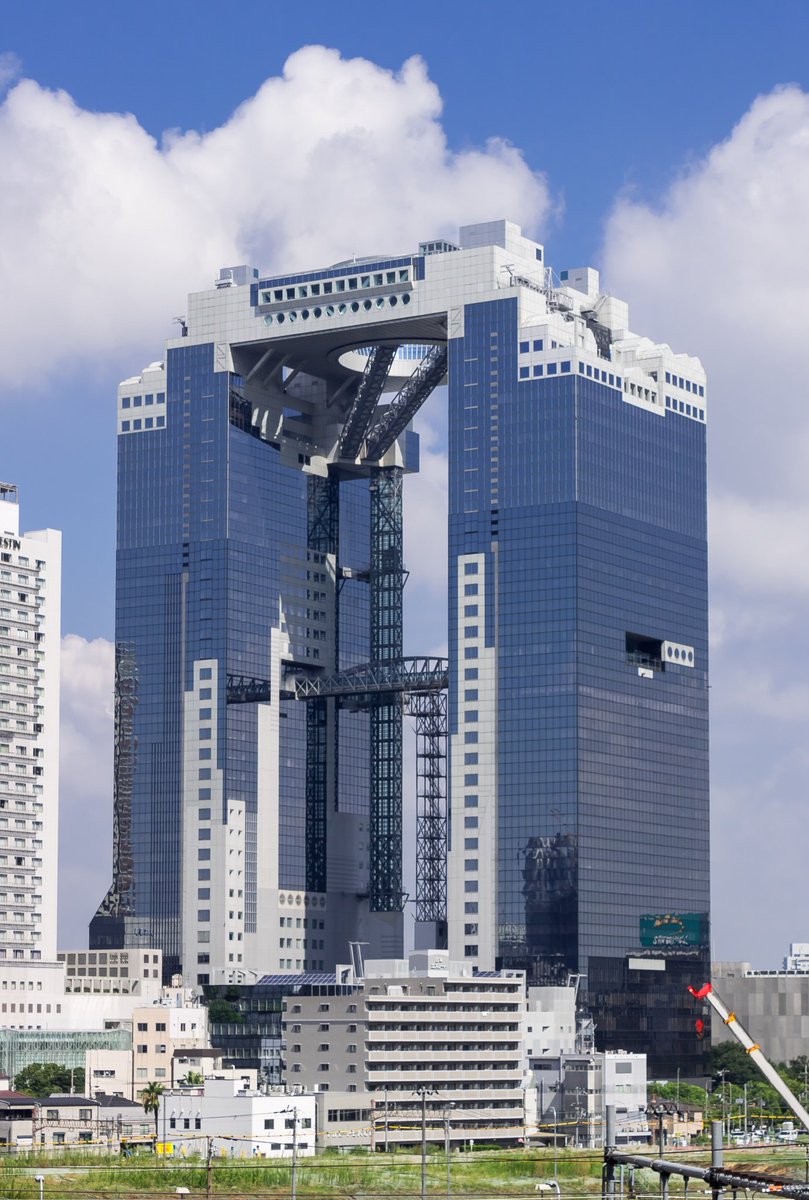 And of course there’s Hara’s Umeda Sky Building in Osaka, the hole on the top of which you rise through on two vertiginous escalators, & was imagined as the void left by a departed spaceship...-Photo from Wikipedia