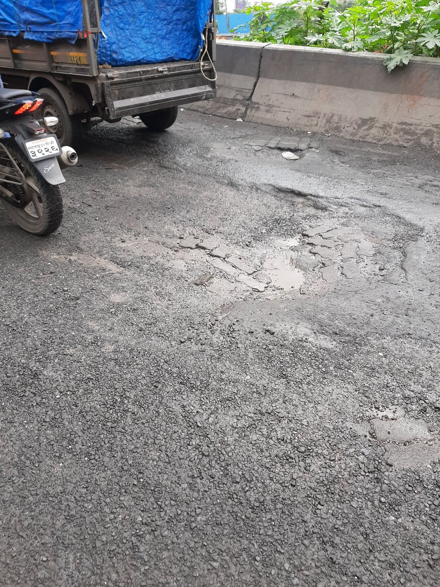muktaghosh2004's tweet photo. And BMC claims there are no potholes in Mumbai and that if found, they will repair in two hours.. Let's see if that happens or not. This is uploaded for your information. It is the bridge next to Bajaj Allianz Rustamjee Aspiree building.
@RoadsOfMumbai @MumbaiMirror @BhaktiPark37 https://t.co/tPP4NSdvoZ