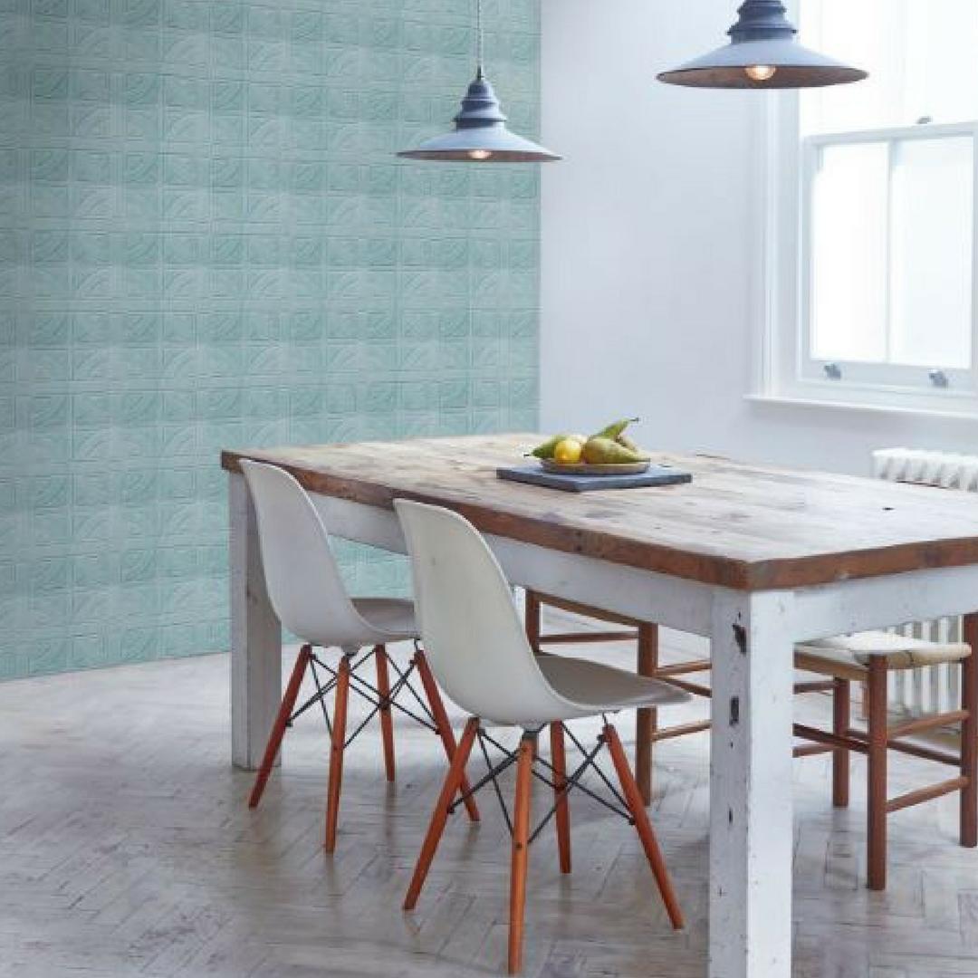 Feature walls are nothing new - but there are still new ways to create one. Experiment with different surface designs and colours to generate your unique look. 
This dining area features London Roundel in Teal. bit.ly/2MjEuDB
#kitchendesign #featurewall #walltiles