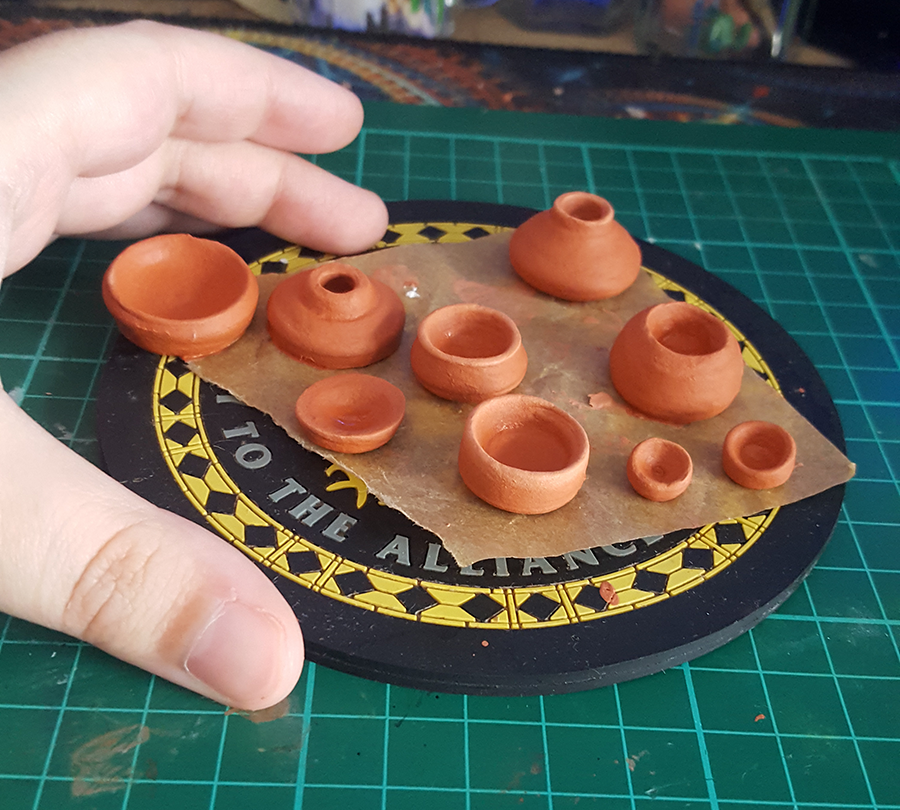 TheHighPaladin's tweet photo. TINY POTTERY!! These are still drying but LOOK AT THEM!!!! I made them on a tiny functional pottery wheel, it was a blast but I got covered in terracotta. #clay #pot #miniature #pottery #potterythrowing #mini #tiny #bowl #jug https://t.co/dLyVKLpuxk