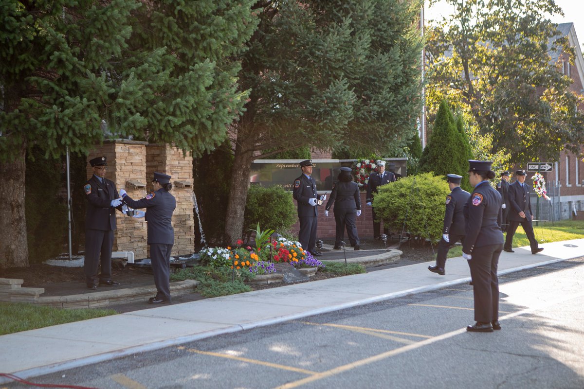 FDNY's tweet photo. #FDNY members remember those who made the Supreme Sacrifice 18 years ago today, and those who have died from illness related to the World Trade Center rescue and recovery efforts, at the September 11th Commemoration Ceremony at the FDNY EMS Training Academy #NeverForget https://t.co/wCJ2MrWj8U
