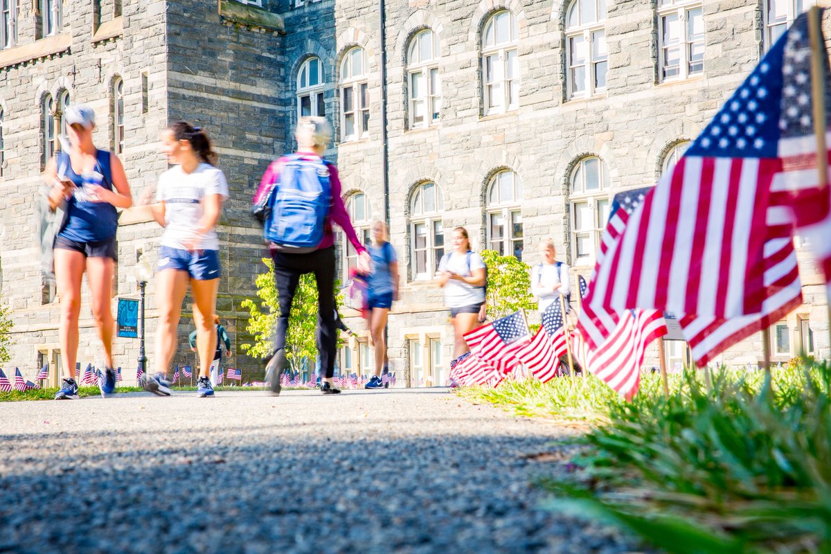 Georgetown's tweet photo. Today, American flags line the walkways of campus, a tradition that is coordinated by the College Democrats and Republicans. Together, we honor and remember those who lost their lives on September 11 and in the years since. #NeverForget https://t.co/DyUPvAr8MF