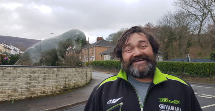BenBlack's tweet photo. The man who made 1000s of people smile when he put a 15ft plastic dinosaur in his front garden in Cwmbran has died. Read the tributes from the family of Jerry Adams https://t.co/iZsalkoYAL https://t.co/yi6ihM54Xz