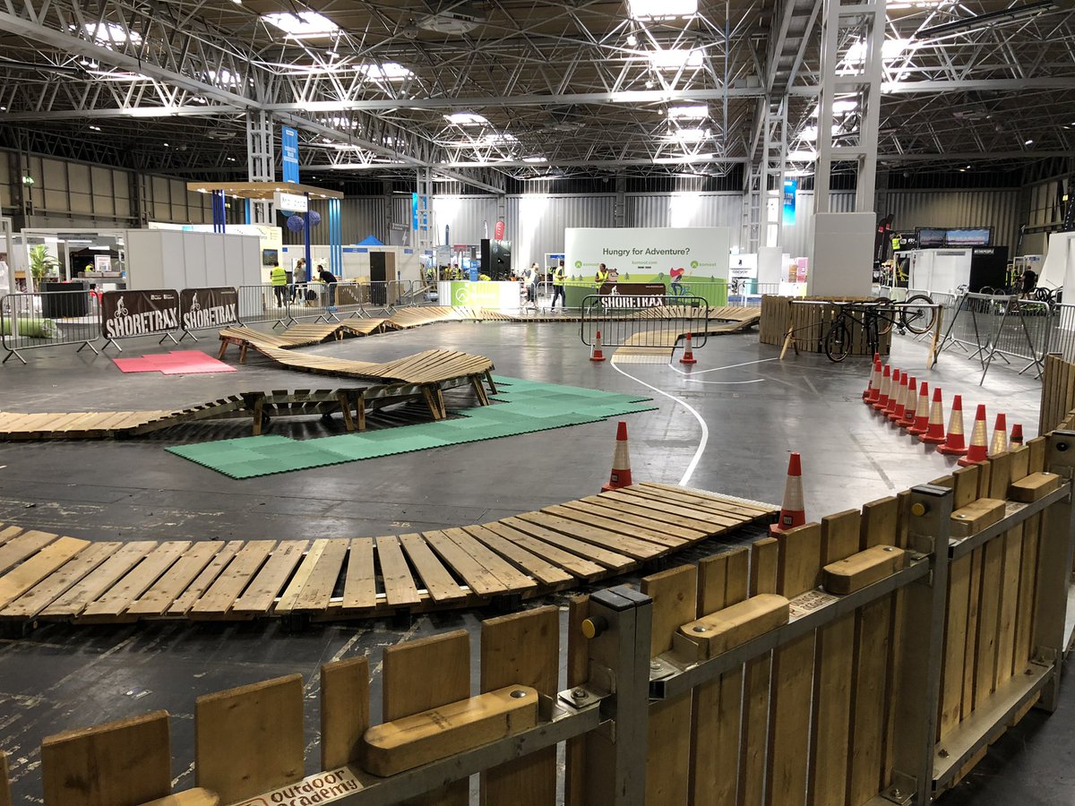 All setup and ready for the first public day starting this Friday until Sunday. Will you be there? @cycleshow <a href="/dmrbikes/">DMR BIKES</a> #cycling #pumptrack #mtb #portablebiketrack #popupbiketrack