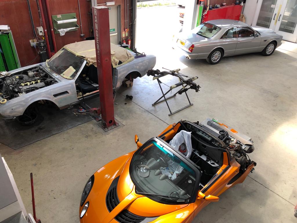 BeaconWorksh's tweet photo. How is your week going? we have some great projects in the workshop - an Aston Martin Volante, a Bentley continental colour change from pearl red to silver pearl, a couple of sick lotuses and a lovely 1974 Etype #beaconsfieldworkshop #lotus #astonmartin #bentley https://t.co/RCbl3wzzYF