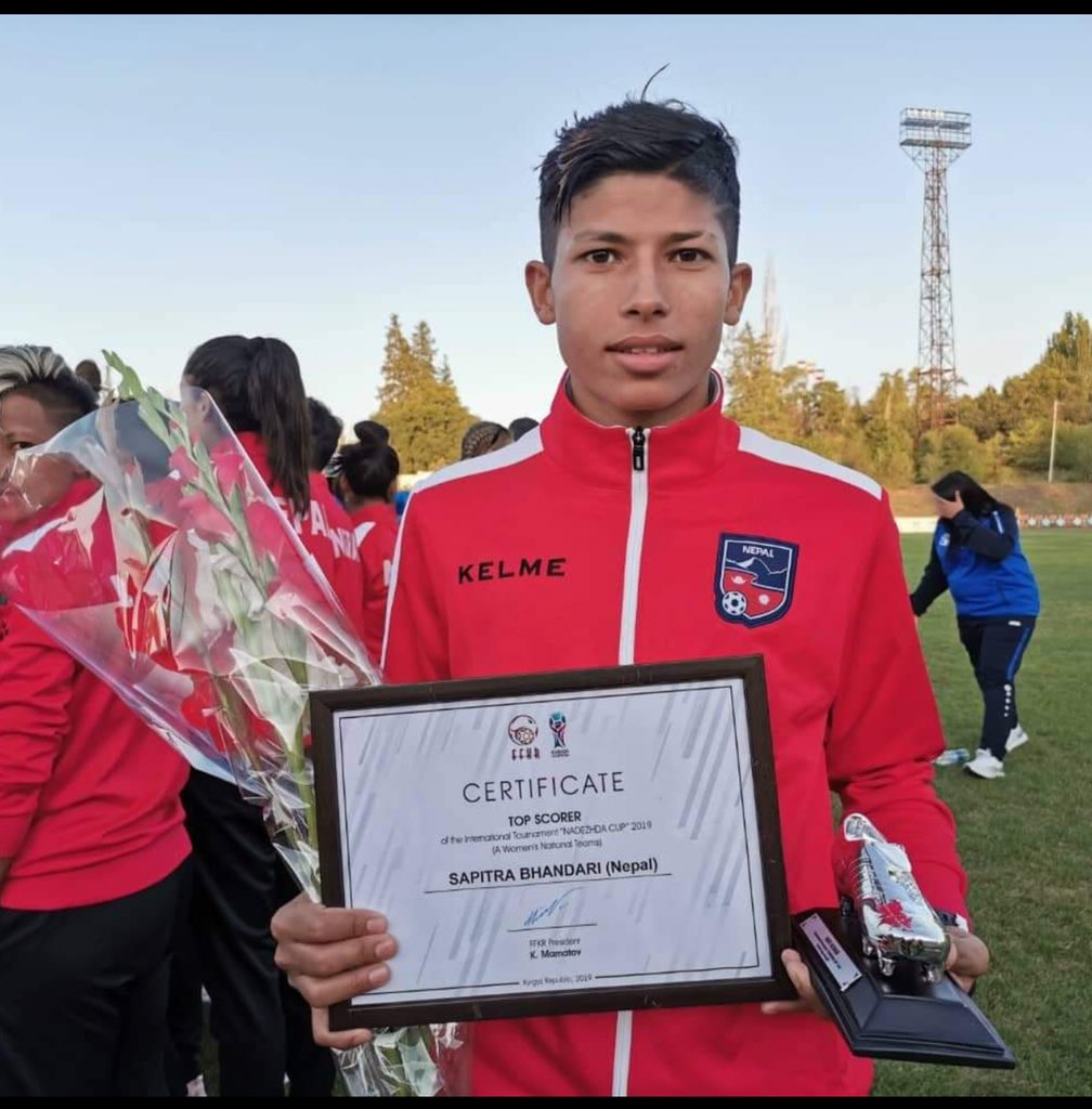 rghising's tweet photo. Sabitra Bhandari, joint all time top scorer with Anu Lama (35 goals) of Nepal 🇳🇵 national football team got highest scorer’s award with 7 goals in Nadezhda Cup 2019.
#NepalFootball #SambaRocks #NadezhdaCup2019 #womensfootball https://t.co/8dMzk4durd
