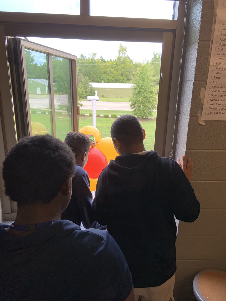 AFSWolfpack's tweet photo. What can Mrs. Ferrugia’s class learn from dropping eggs out of Mr. Singletary’s classroom window? Well, we can model engineering designs for landing safely on Mars! #Pridein5 #Learnin5 #GrowingthePACK https://t.co/UP4hsi9Kq5