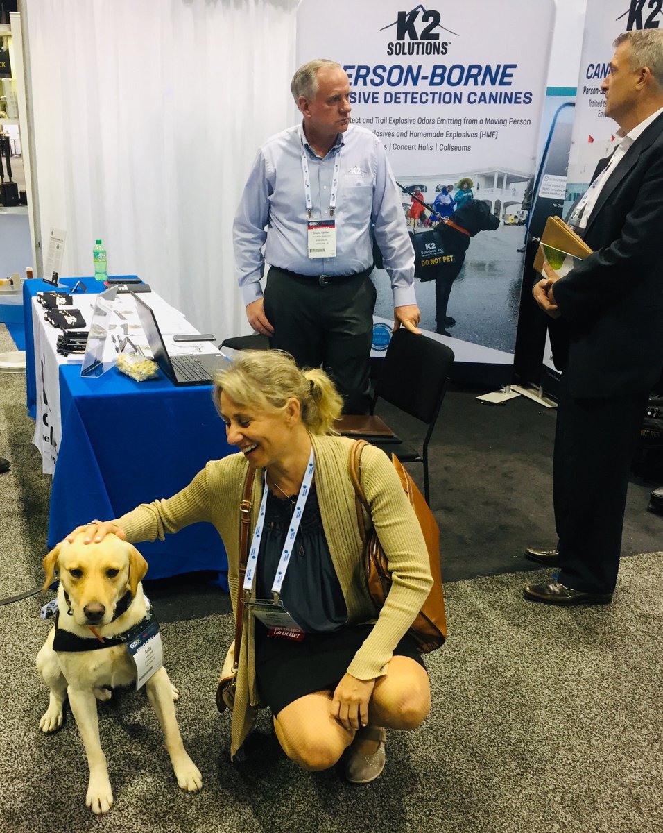 Export2Europe's tweet image. Our colleague from @USembassyMadrid with a special US exhibitor at #GSX19: #workingdogs. K2 Solutions threat mitigation and #caninedetection services learning about #export2europe opportunities