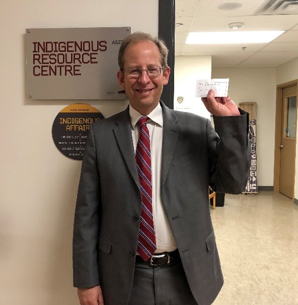 KellyAnneButler's tweet photo. Grenfell VP Jeff Keshen with the winning ticket on the prize draw held at the Indigenous Student Caucus table today during the Get Involved Fair @grenfellcampus #getgrenfelled https://t.co/HfGuqL8tx1