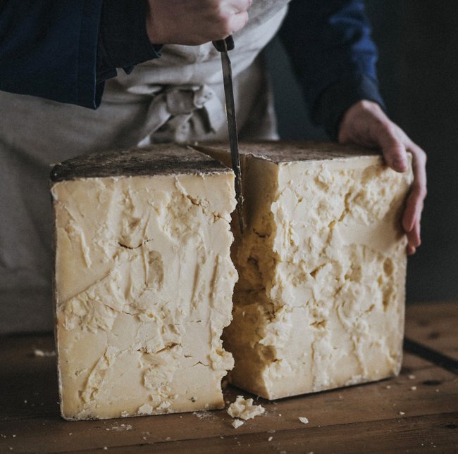 QuickesCheese's tweet photo. The moment the truckle cracks just right is awe-inspiring, that solid bulk of cheese resisting and resisting until finally...crack, and it opens to reveal its beautifully textured inside. Watch the video on our blog: https://t.co/03mGplOCMV #quickescheese #italiancheesemonth https://t.co/G8ZTq1Jnlc