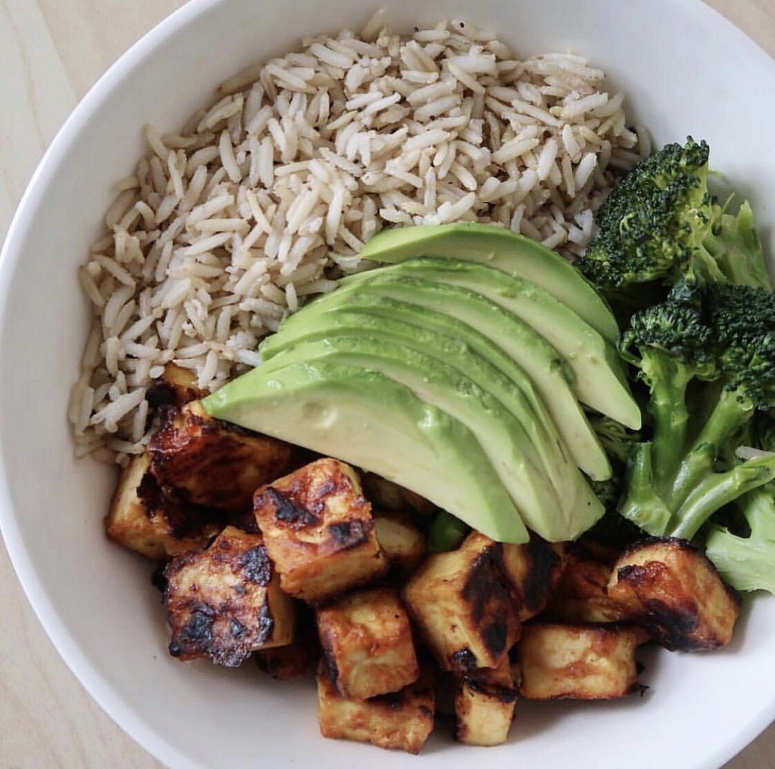BBQ tofu:
* Press the water out, cut into cubes, and put in a large mixing bowl
* 1 tbsp nutritional yeast 
* 1 tbsp tapioca flour 
* Add as much bbq sauces as you like 
* Mix well, and bake at 450F for 25-30 mins flipping halfway through. #vegan #govegan #plantbased #food #yum