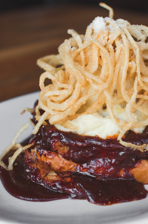 thefoxandturtle's tweet photo. We stack our BBQ meatloaf up HIGH! Wrapped with bacon, smothered in BBQ sauce and and onion strings piled on top, this is a GAME CHANGER. https://t.co/6X8KryvQUe