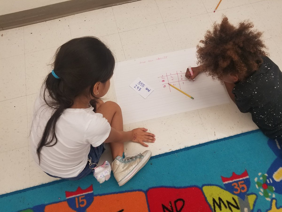Students hard at work formulating math problems! They used different math strategies to solve addition and subtraction problems.