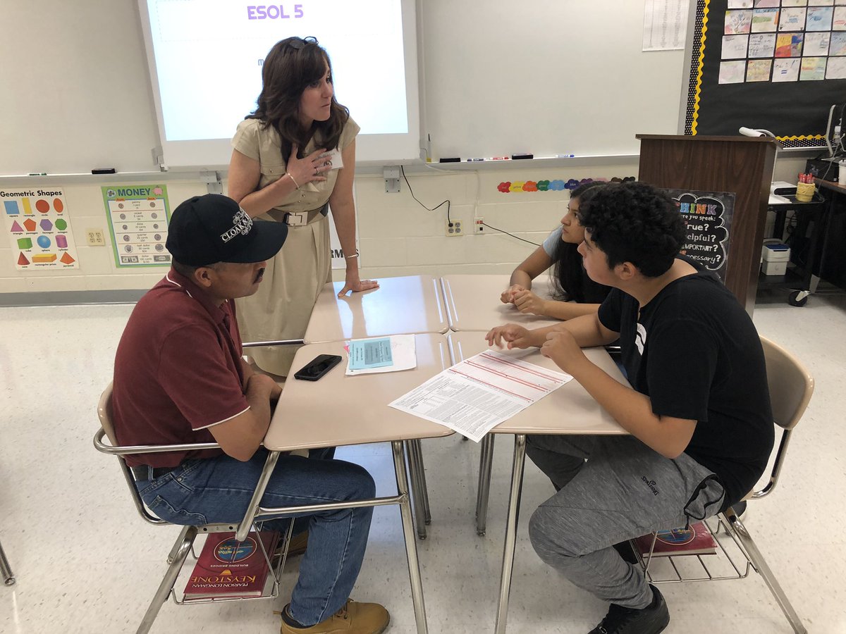 RMHS_ESOL_Dept's tweet photo. ESOL teachers and students helping parents/guardians negotiate our school system and get to know what makes ESOL special. Students looked so proud to bring their parents to classes! #ESOLpride #mcpsbtsn https://t.co/Cc4Ib26LNA
